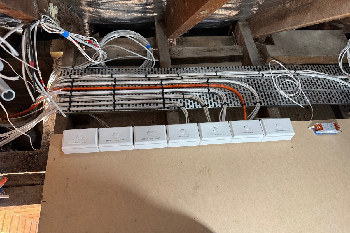 Row of PIXIE dimmers and switches grouped on a mounting board