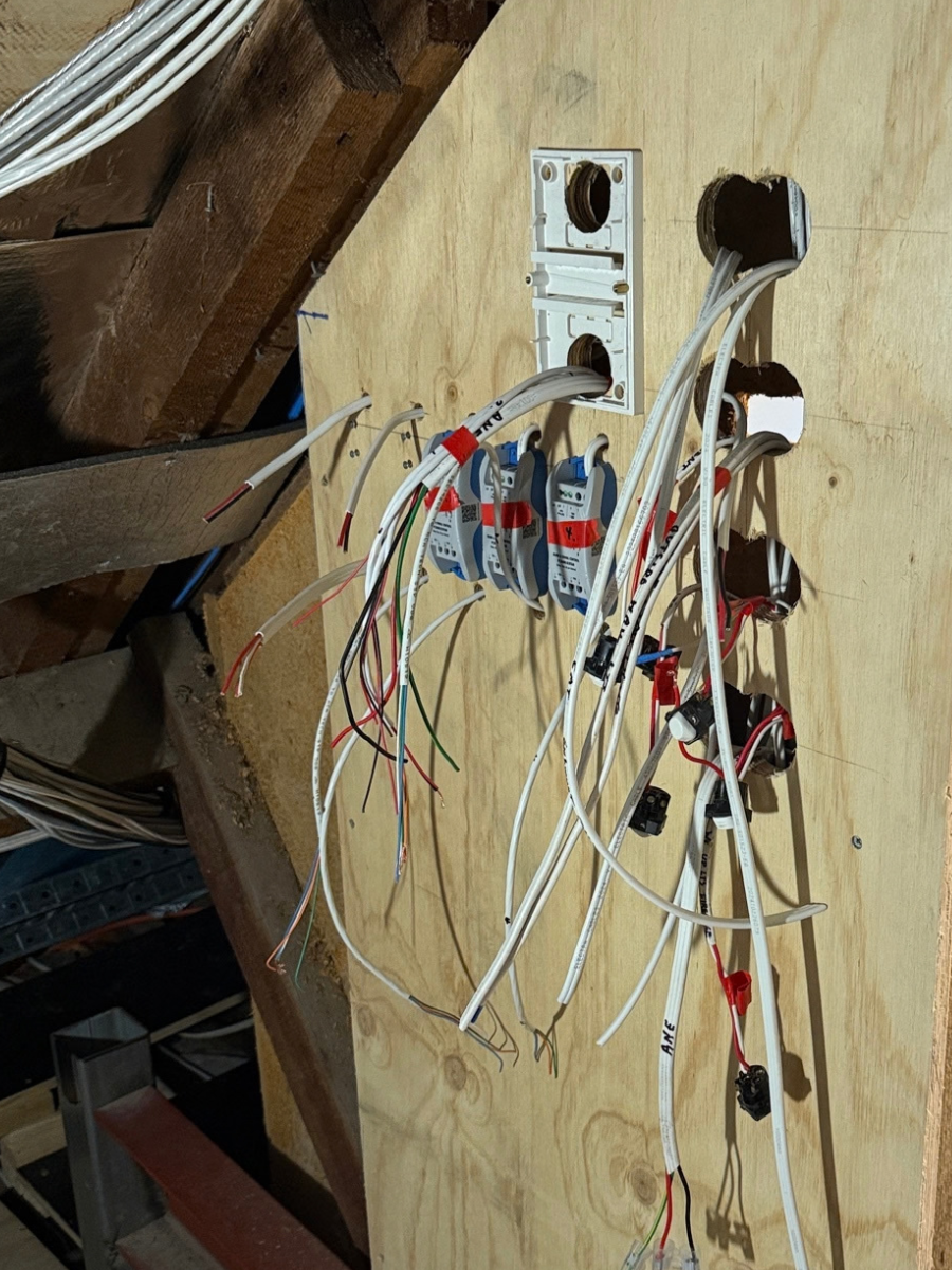 Multi-gang PIXIE dimmer and switch assembly on a mounting block in the ceiling space