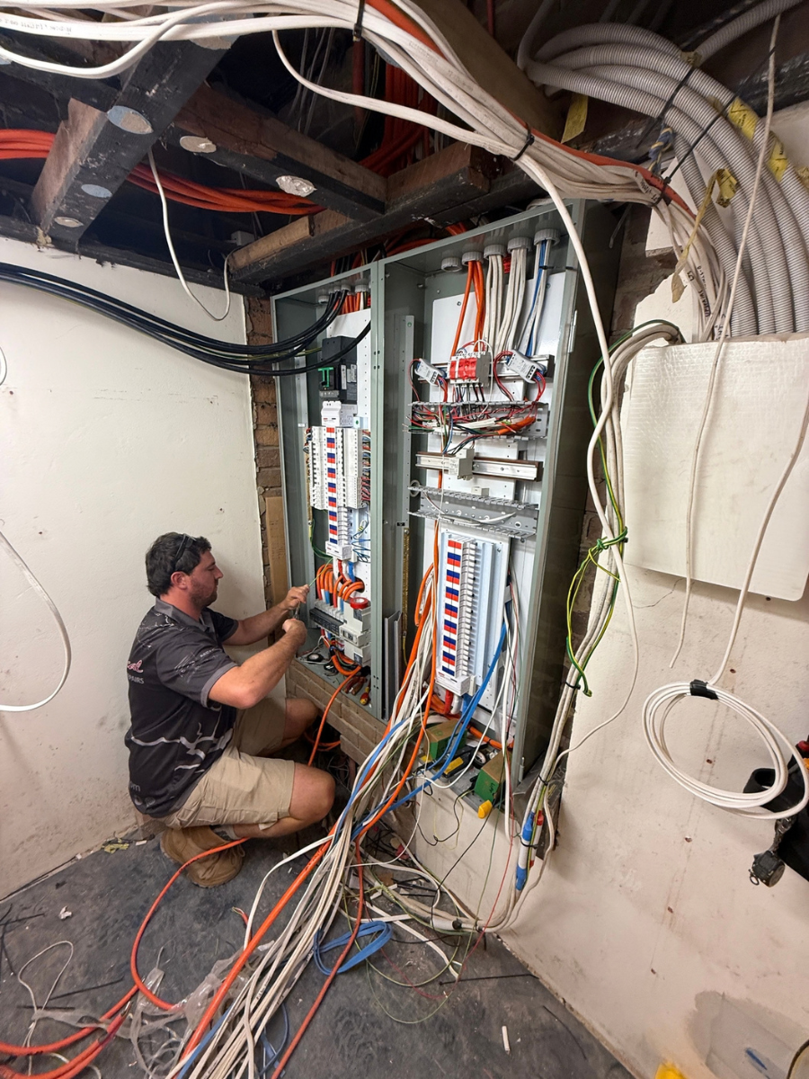 Electrician working on the upgraded switchboard