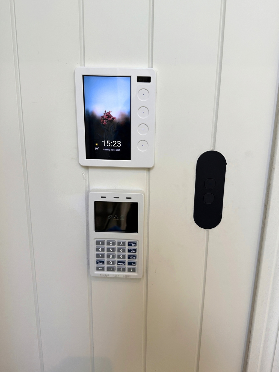 PIXIE Touch Panel and flush-mounted ZETR plate on a panelled wall